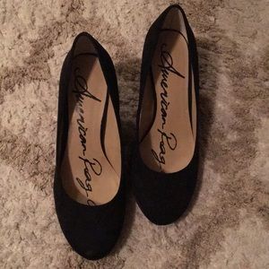 Black suede pumps